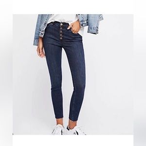 Free people. Dark wash skinny jeans. Button fly. Raw ankle hem. Size 25.